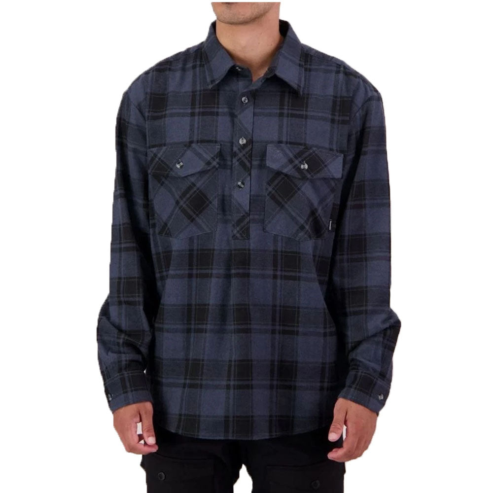 A man wearing a dark navy and black plaid long-sleeve button-up shirt with two chest pockets, shown from the neck down against a plain white background.